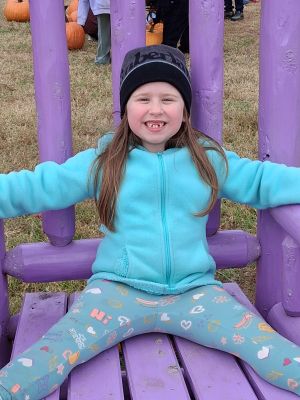 Side view of professional female African American therapist sitting in front of black male patient during psychotherapy session in office